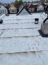 Roll Them Lay Them Roofing logo