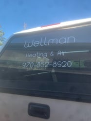 Wellman Heating & Air logo