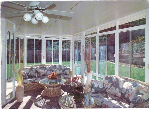 Contemporary Sunroom with sliding glass windows
