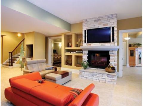 Modern Basement with stacked stone fireplace facing