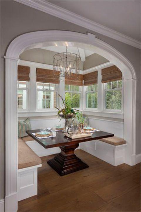 Transitional Dining Room with fabric roman shade window covering