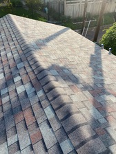 Logo for Hellman Roofing and Gutters