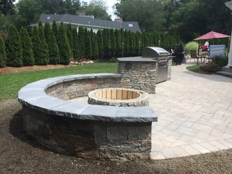 Angie's Construction & Landscaping logo