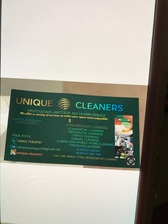 Unique Cleaners logo