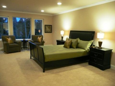 Contemporary Bedroom with green bedspread and pillows