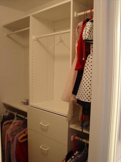 Traditional Closet with white built in cabinetry in closet