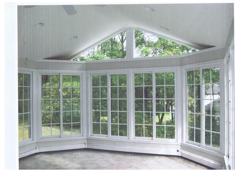 Contemporary Sunroom with electric baseboard heat