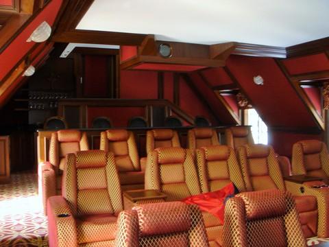 Traditional Home Theater with custom gold theater seating