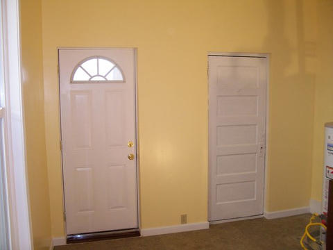 Transitional Entry with yellow painted walls
