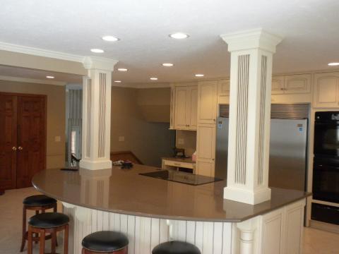 Transitional Kitchen with large white support columns in kitchen island