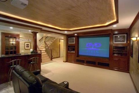Transitional Home Theater with custom built-in entertainment center