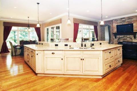 Traditional Kitchen with medium wood stain flooring