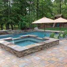 Contemporary Pool with in ground hot tub