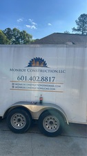 Logo for Monroe Construction LLC