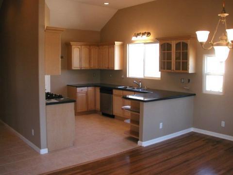 Traditional Kitchen with black granite counters