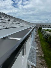 Reigning Seamless Gutters logo