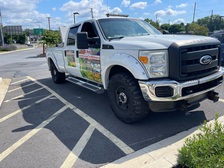 R Pinto Lawn Care logo
