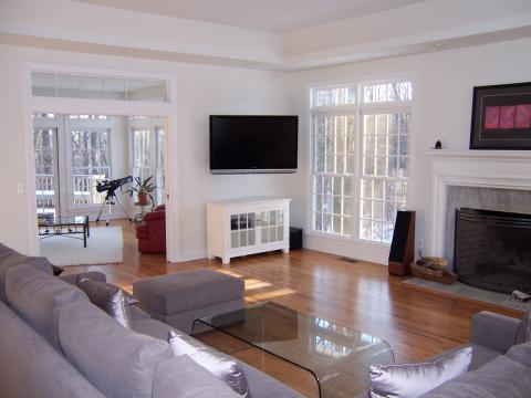 Contemporary Family Room with black metal coffee table with glass top
