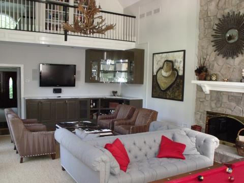 Eclectic Family Room with dark wood custom media console
