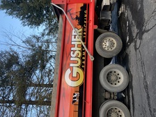 Logo for Gusher Trucking & Excavating Inc