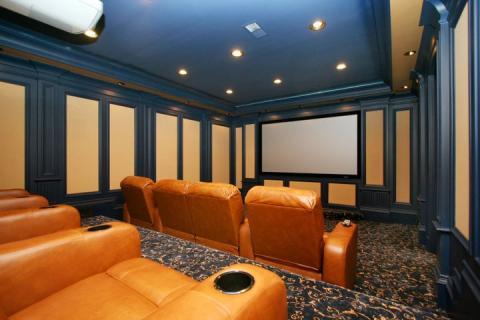 Traditional Home Theater with yellow leather recliner chairs