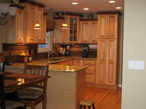 Traditional Kitchen with dark wood cabinet crown moulding