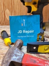 Logo for JD Repair