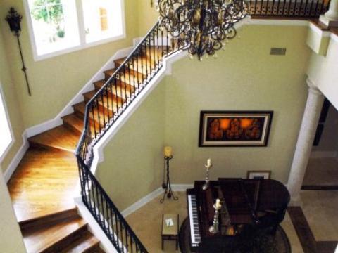 Traditional Staircase with soft yellow painted wall