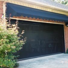 Transitional Garage with black canvas awning at garage
