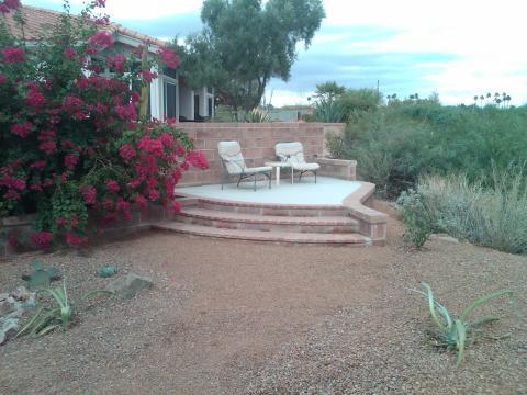 Transitional Landscape with small cement patio with brick stairs