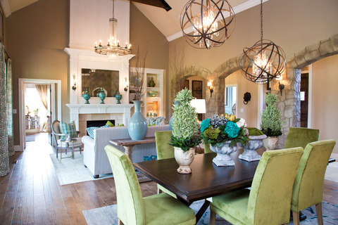 Eclectic Dining Room with chandelier lighting encased in spherical brass