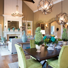 Eclectic Dining Room with chandelier lighting encased in spherical brass