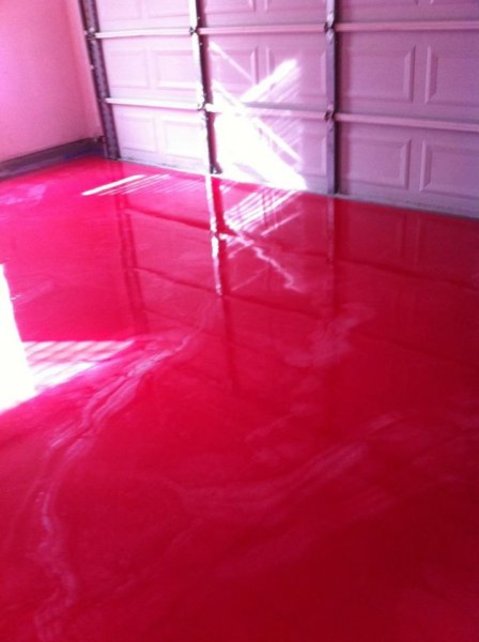 Eclectic Garage with deep red epoxy coated concrete floor