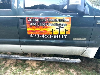 Crossroads construction and land clearing LLC logo