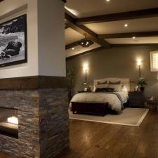 Contemporary Bedroom with dark wood ceiling beams