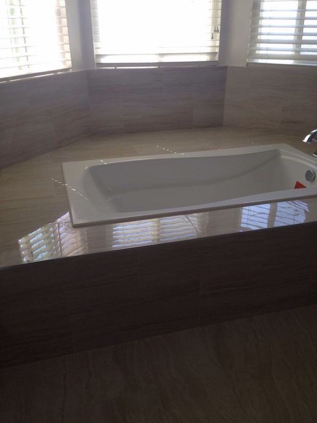 Transitional Bathroom in Sherman Oaks drop in tub with tile surround