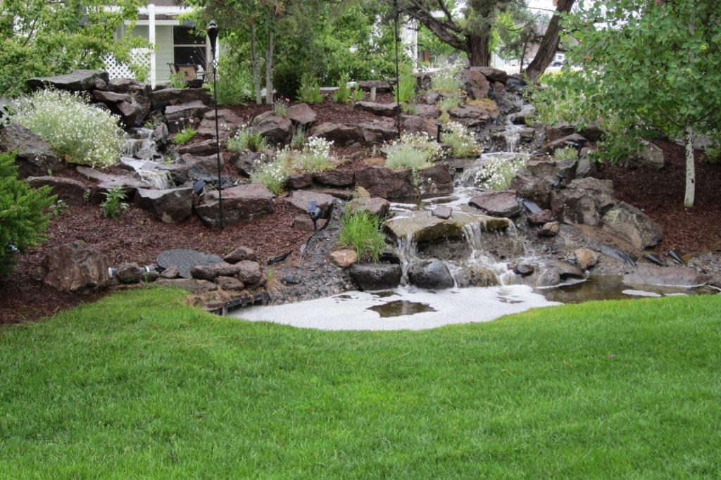 Villanueva Brothers landscape maintenance logo