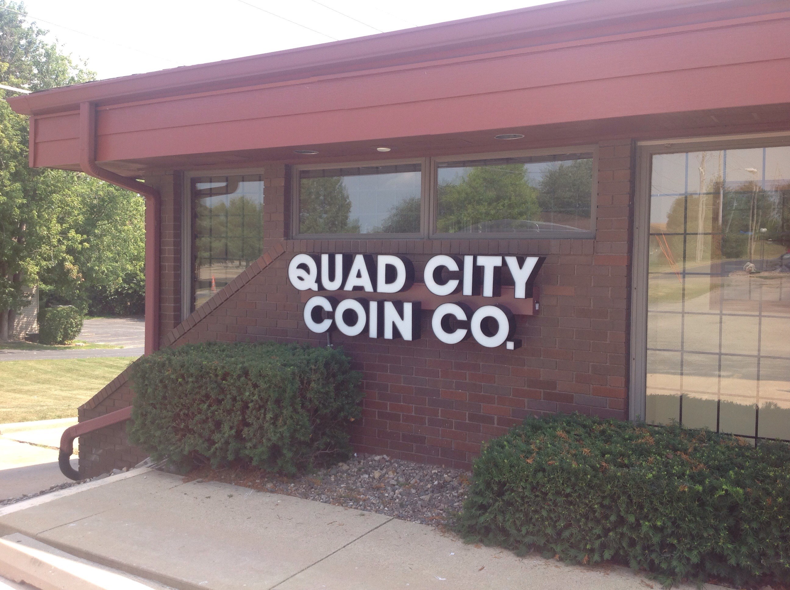 Quad City Coin Co. logo