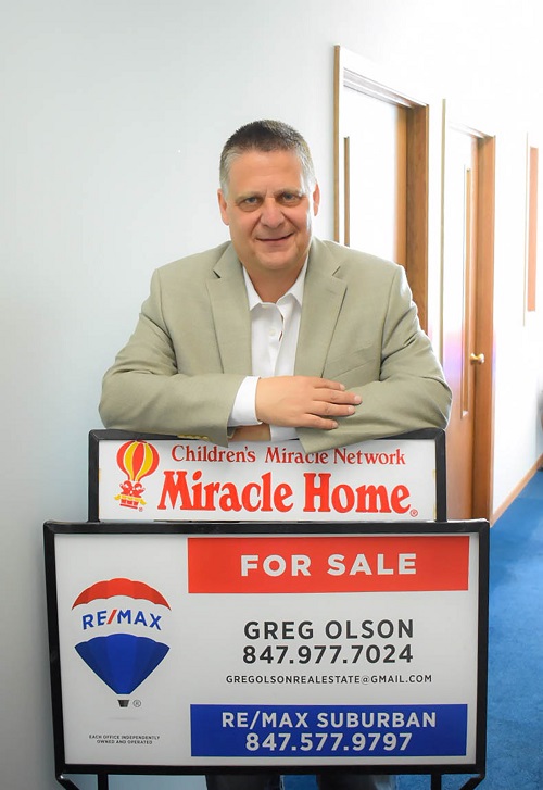 GREG OLSON logo