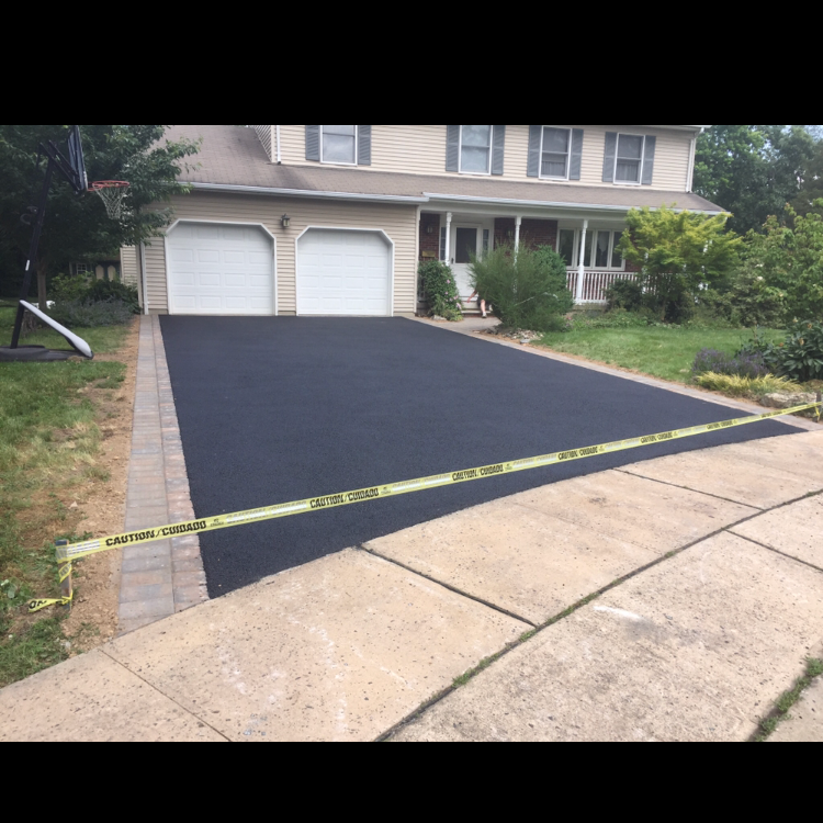 OMEGA PAVING & MASONRY logo