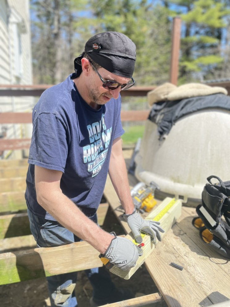 The Guy That Fixes Everything logo