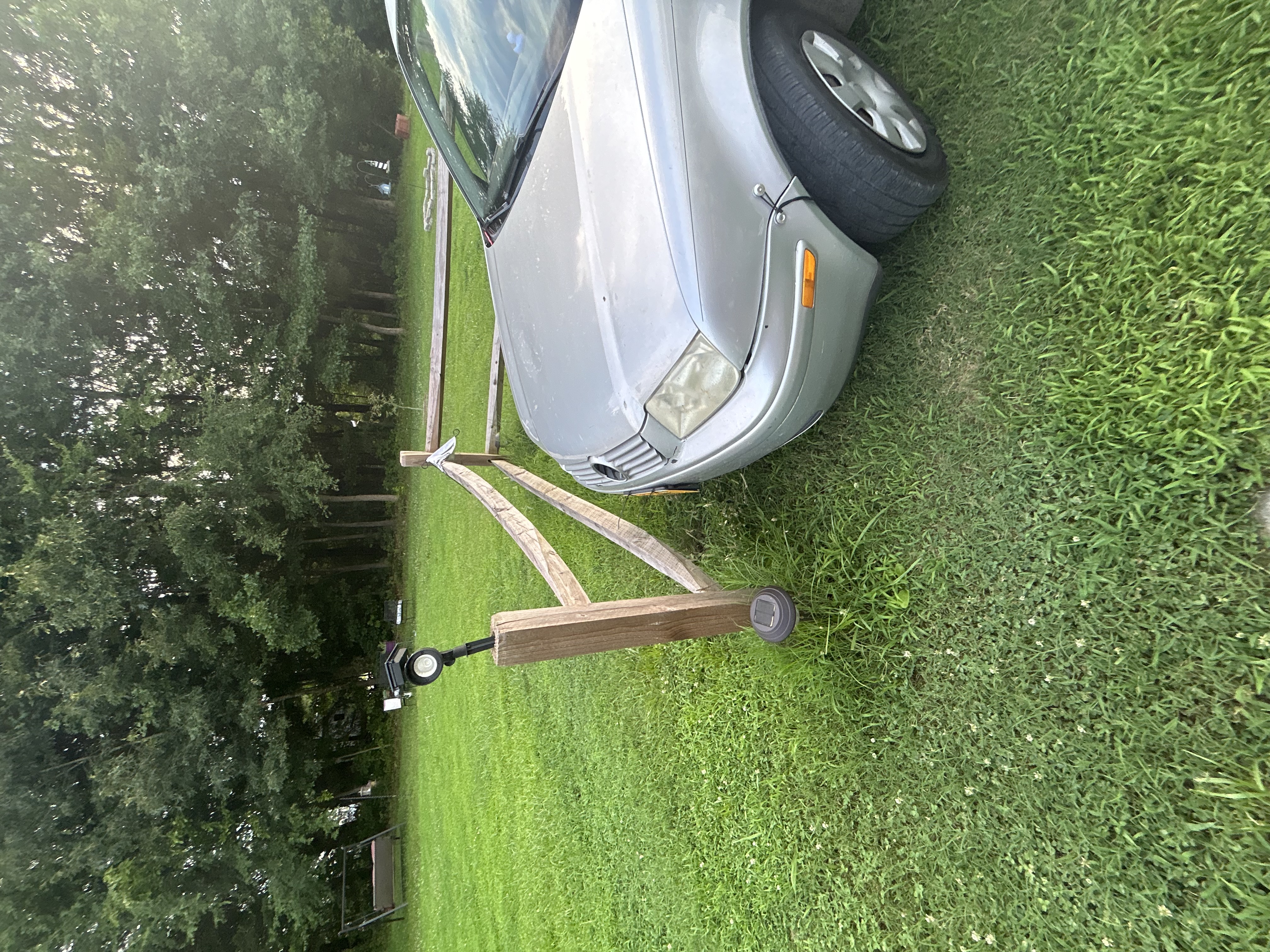 Katura and Wilson Lawn Care Service logo