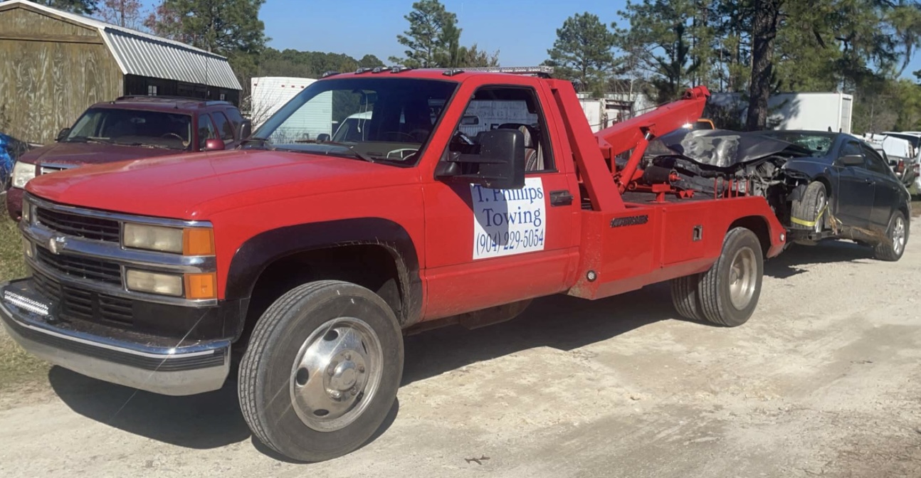 T. Phillips Towing & Off-Road Recovery logo