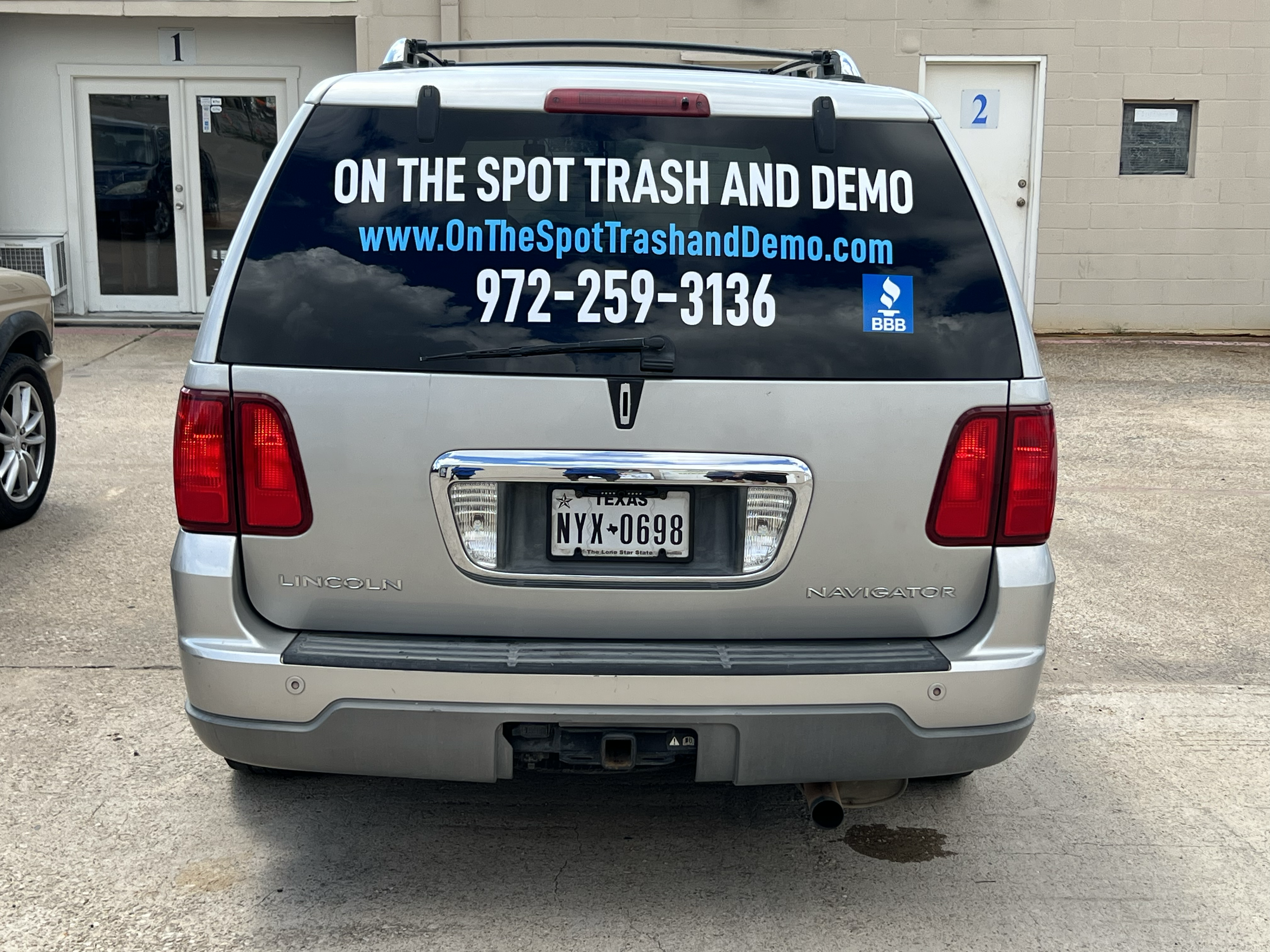 On the spot trash and demo. logo