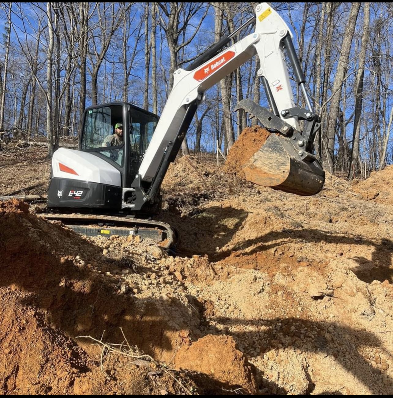 Delmars Excavating logo