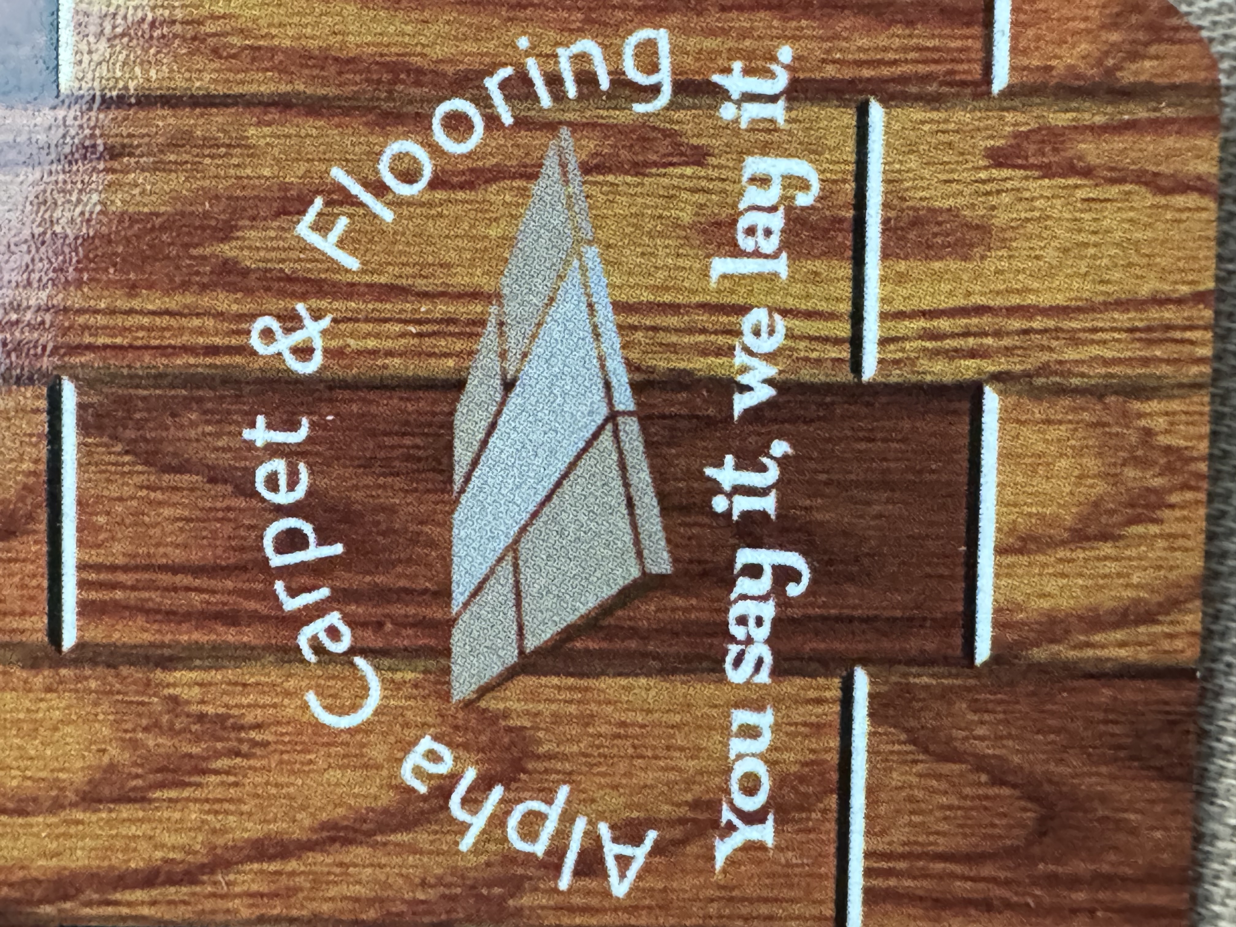 Alpha flooring and carpet logo