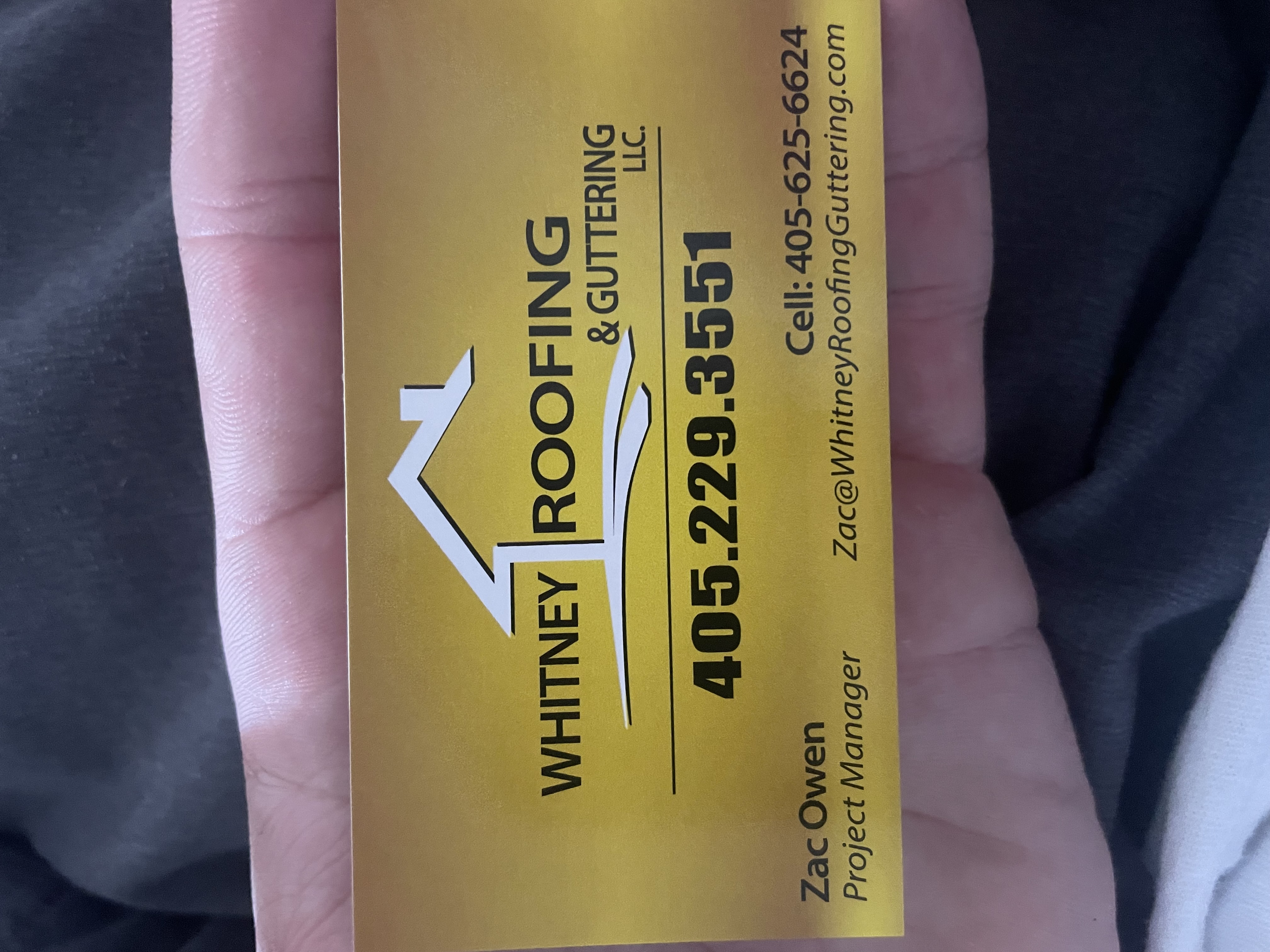 Zac Owen with Whitney Roofing & Guttering logo