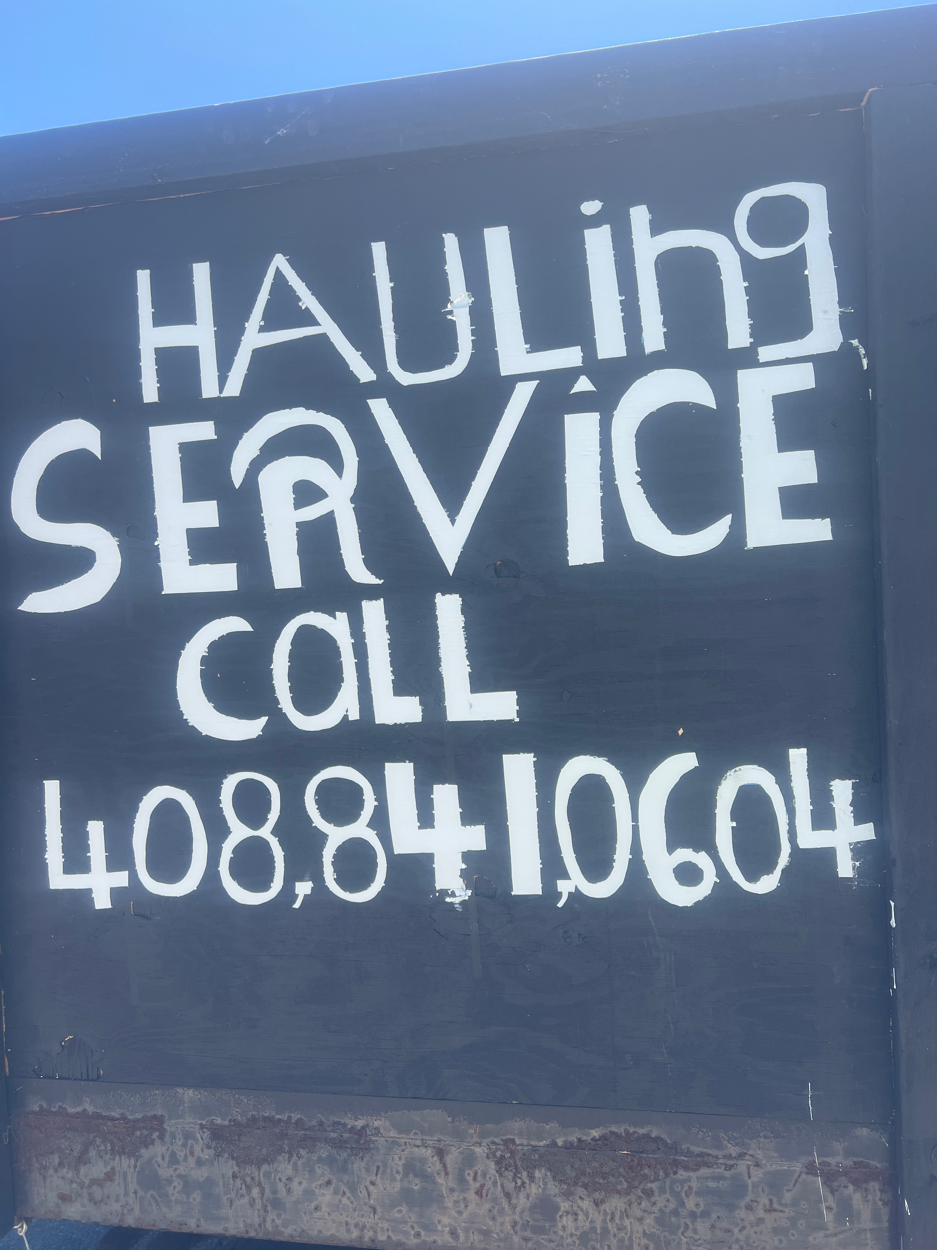 Hauling service logo