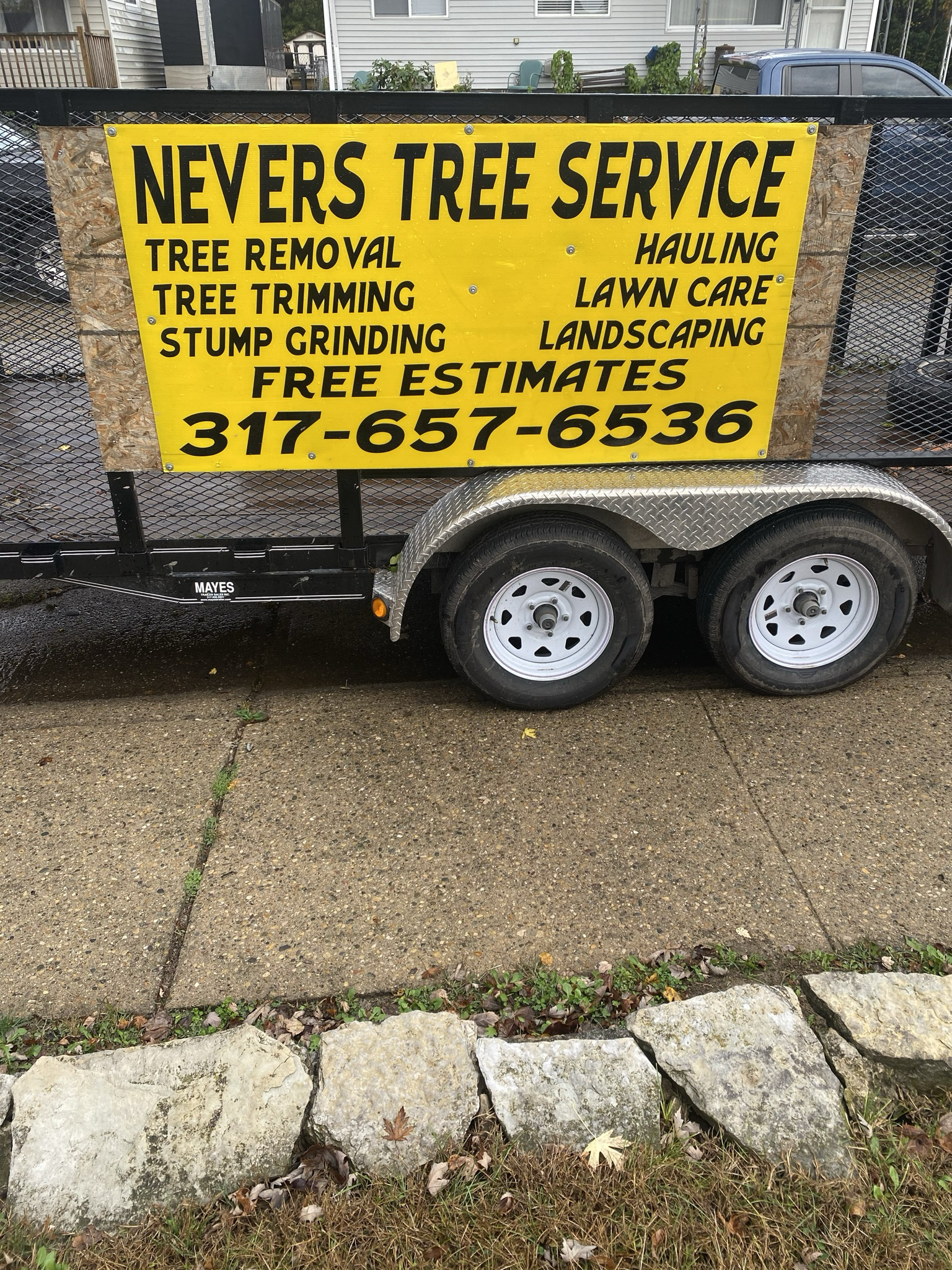 NEVERS TREE SERVICE logo