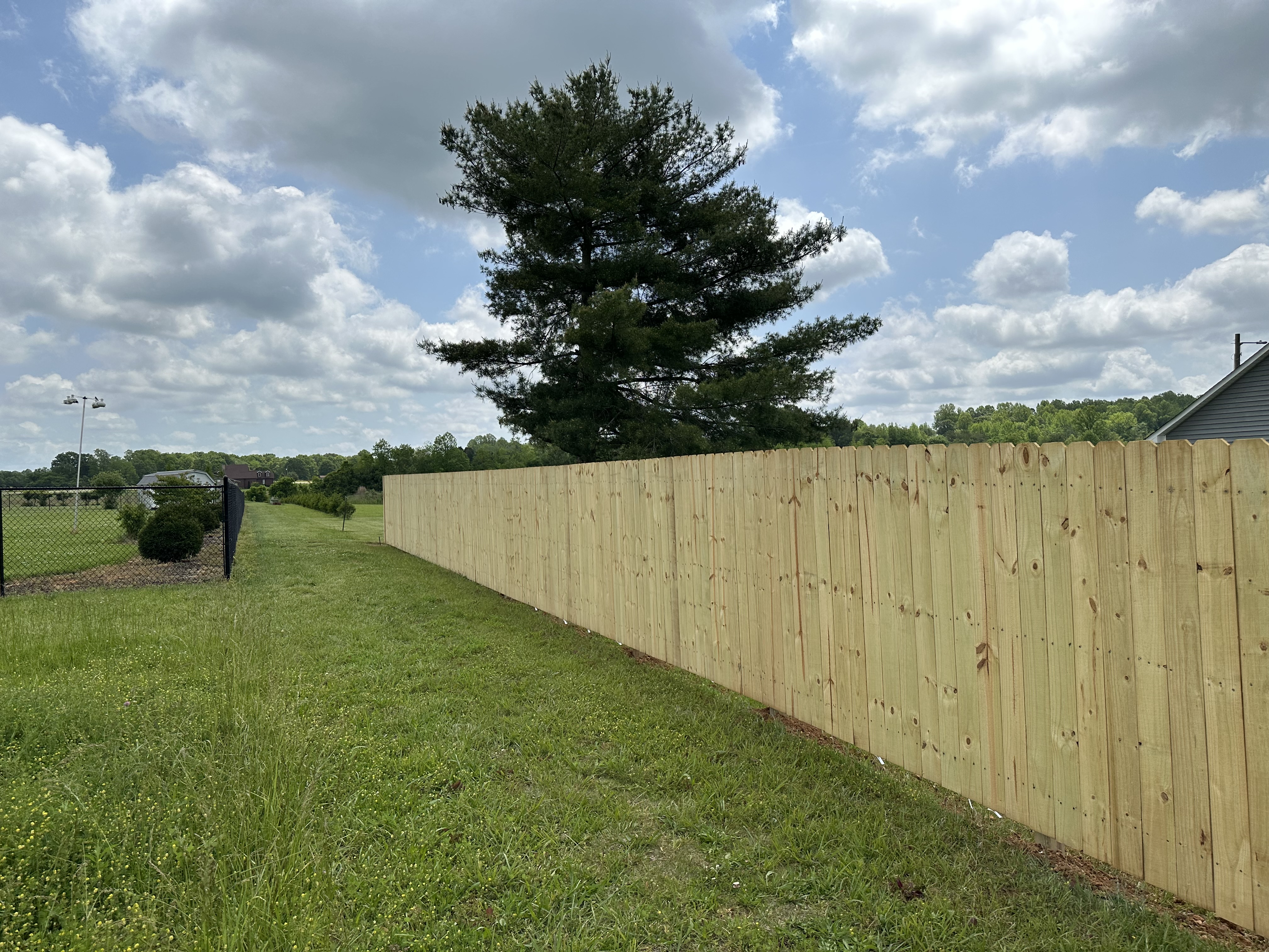 Back yard Fence builders logo